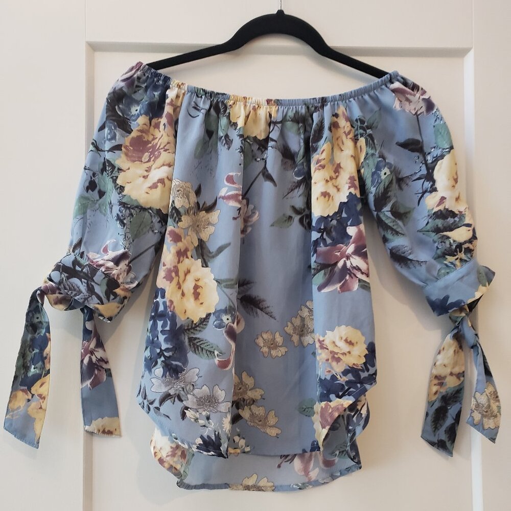 Bundle of two women's size small floral tops, blue off the shoulder & bl…